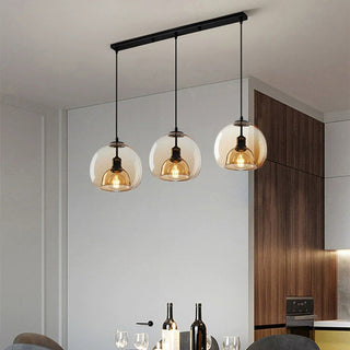Modern orb pendant with handblown amber glass shade