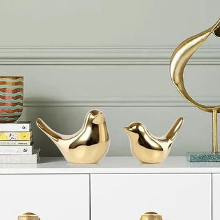 golden bird figure handmade enamel ceramic bird sculpture elegant home decor lifestyle view