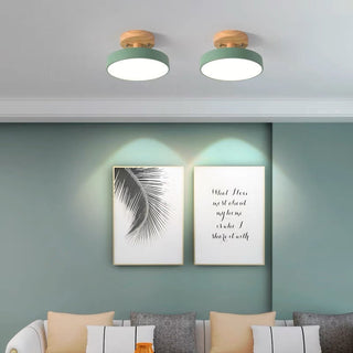 LED ceiling fixture with wood finish in living room, modern style