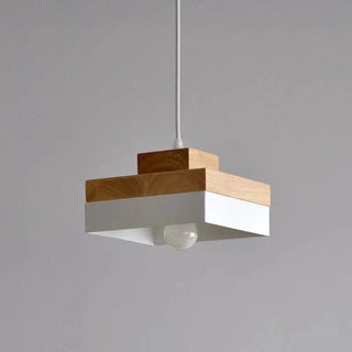 Industrial wood pendant over dining room table