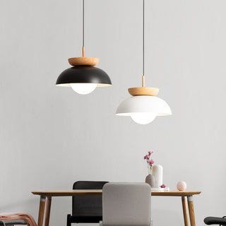 Creative iron pendant with wood accent over dining table