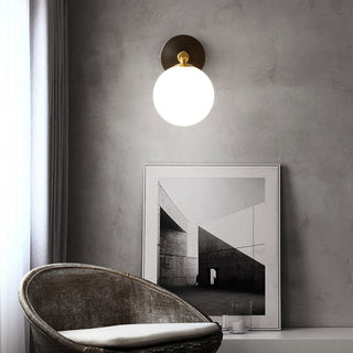 Luxury copper ball wall lamp in living room — warm sconce