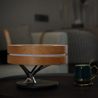 Wireless charging LED bedside lamp illuminated — warm glow