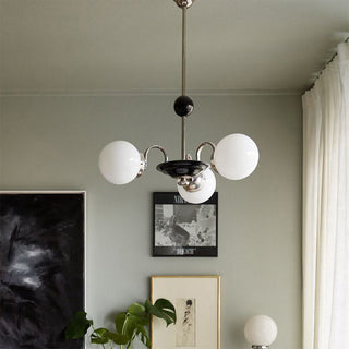 Nordic glass chrome 3-globe chandelier ambient — warm ceiling