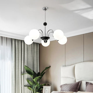 Chrome 3-globe chandelier detail — Nordic glass warm living room