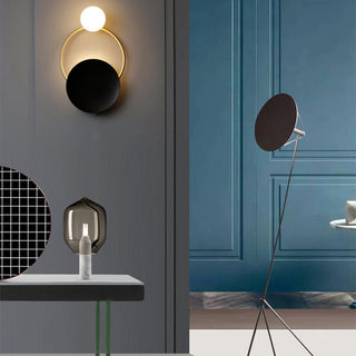 Industrial black gold metal circle wall sconce detail — vintage