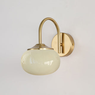 Modern pink glass wall lamp bedroom illuminated — gold sconce
