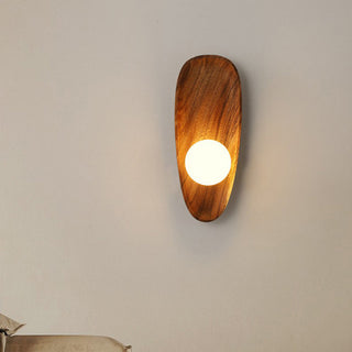 Solid wood wall sconce minimalist detail — dining room
