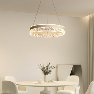 Circular LED acrylic pendant hanging in contemporary interior