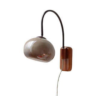 Wood and glass wall sconce in living room — modern indoor light