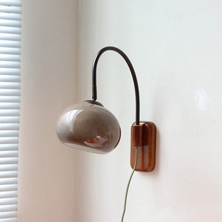 Natural wood glass wall sconce detail — modern indoor lamp