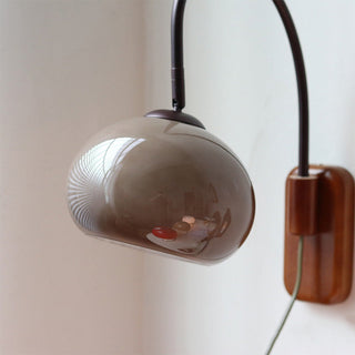 Modern wood wall sconce with natural wood and glass design — indoor