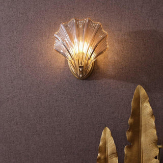Modern sea shell wall lamp amber glass illuminated — sconce