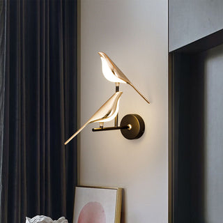 LED golden bird acrylic wall lamp in hallway — modern sconce