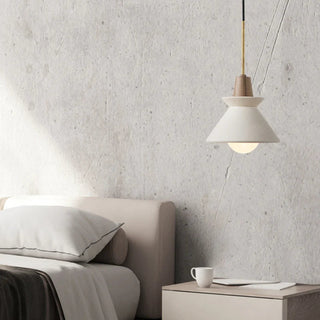 Concrete white cone pendant over modern dining table