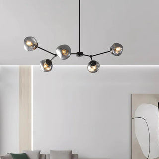 Lava glass chandelier close-up — modern brass molecular detail