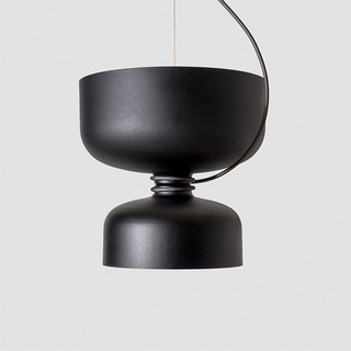 Nordic metal pendant lamp casting focused downward light