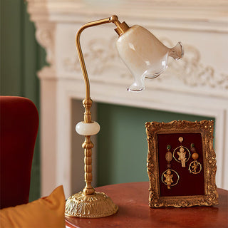 Brass flower shade lamp close-up — vintage floral detail