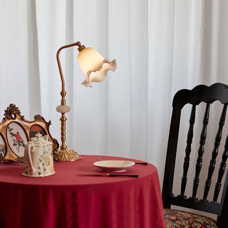 Vintage floral lamp illuminated — solid brass flower warm