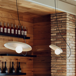 Minimalist iron pendant hanging in bedroom corner