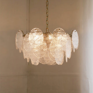 Large gold frame ice glass chandelier detail — pendant warm texture