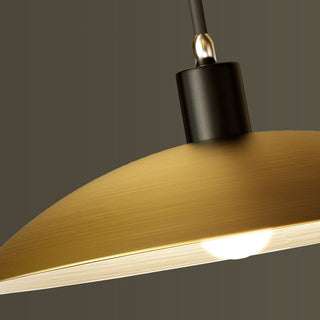 Bell shaped brass pendant lamp in interior — antique dining fixture