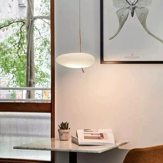 Pebble-shaped white glass pendant with metal frame