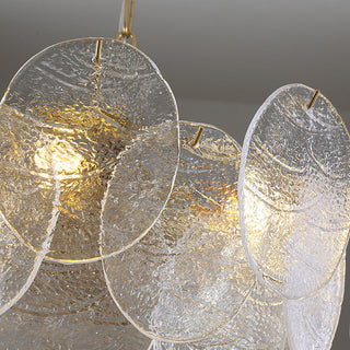 Large ice glass chandelier ambient — gold frame pendant warm glow