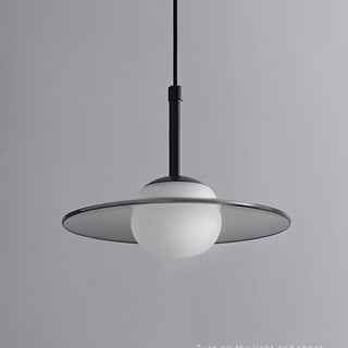 Grey glass pendant in interior — modern dining room fixture
