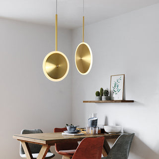 Modern gold frame chandelier illuminated — elegant dining ceiling lamp