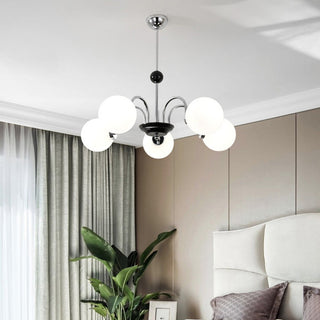 Nordic glass chandelier detail — chrome 3-globe warm texture