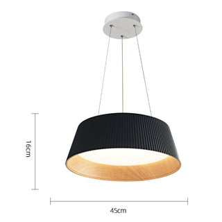 Modern pendant with vertically ribbed shade over dining table