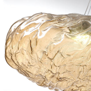 Glass cloud pendant lamp in living room with warm glow