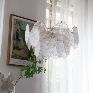 Large ice glass chandelier illuminated — gold frame pendant warm