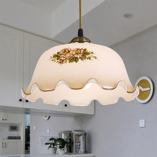 Small metal pendant with floral glass pattern design