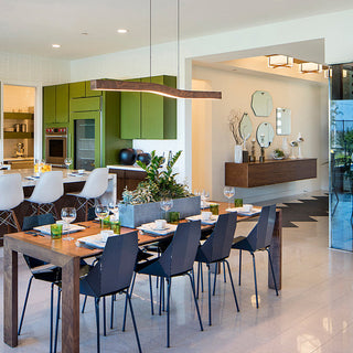 LED linear pendant hanging over kitchen island — modern ceiling lamp