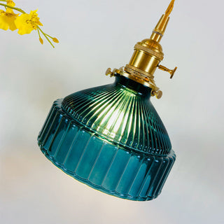 Classic glass pendant with ornate brass ceiling mount