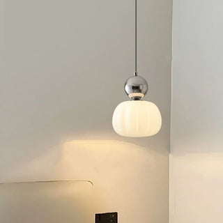 Mini pumpkin shade pendant casting warm ambient light