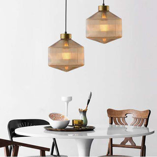 Clear glass ceiling lamp with adjustable cord — dining room