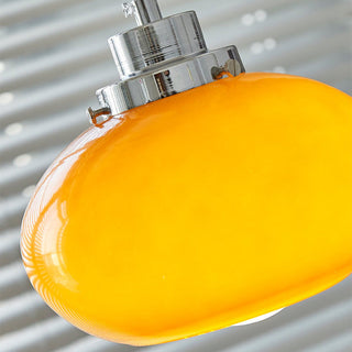 Bauhaus pendant from below — yellow glass adjustable fixture