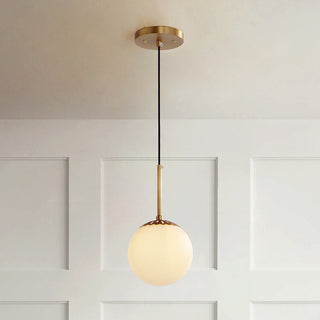 Vintage brass single head pendant hanging in retro interior