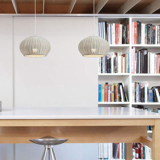Rattan lantern pendant hanging in Bauhaus interior — modern ceiling lamp