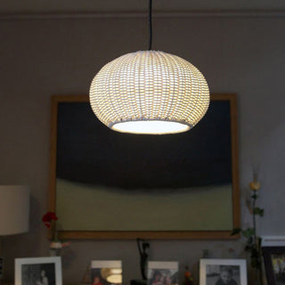Woven lantern pendant in interior — Bauhaus rattan ceiling lamp