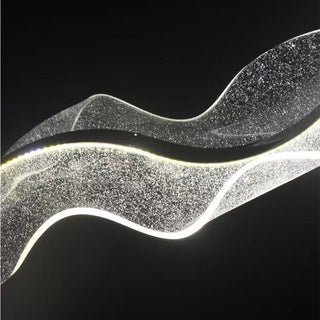 Ripple glass pendant casting undulating light pattern
