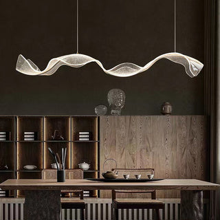 Modern pendant with water ripple-inspired glass shade