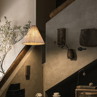 Boho rattan pendant with wooden shade hanging in interior