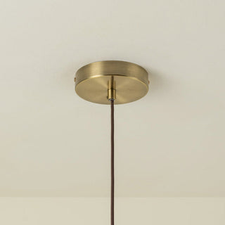 Rattan pendant over kitchen island with warm ambient light