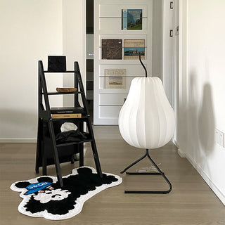 Modern silk pear floor lamp illuminated — soft warm glow