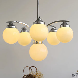 Adjustable round glass pendant chrome fixture from below angle