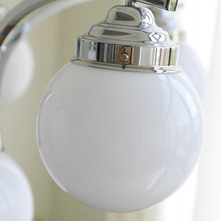 Retro chrome glass pendant chandelier warm light close-up